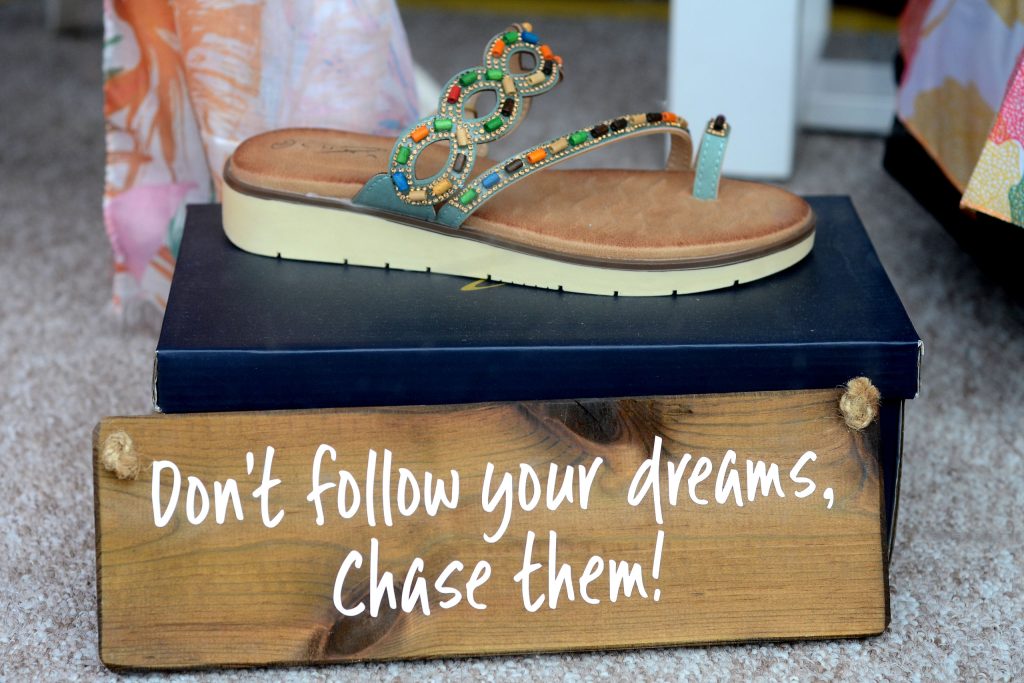 "Chase your dreams" sign in window of The Coastal Boutique Honiton
